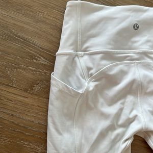 Lululemon white leggings with unique stitching and two side pockets. Size 4